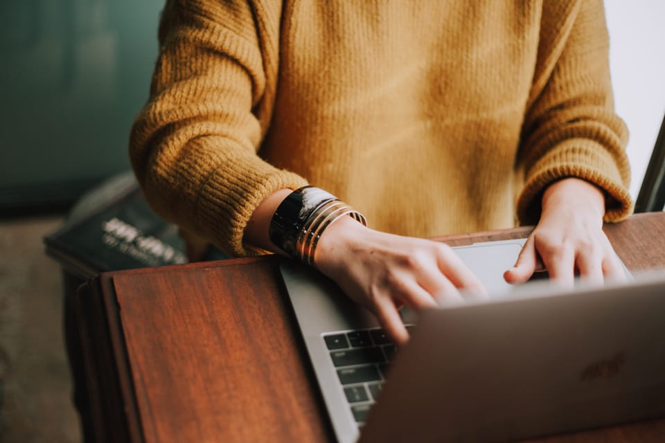 person using their laptop